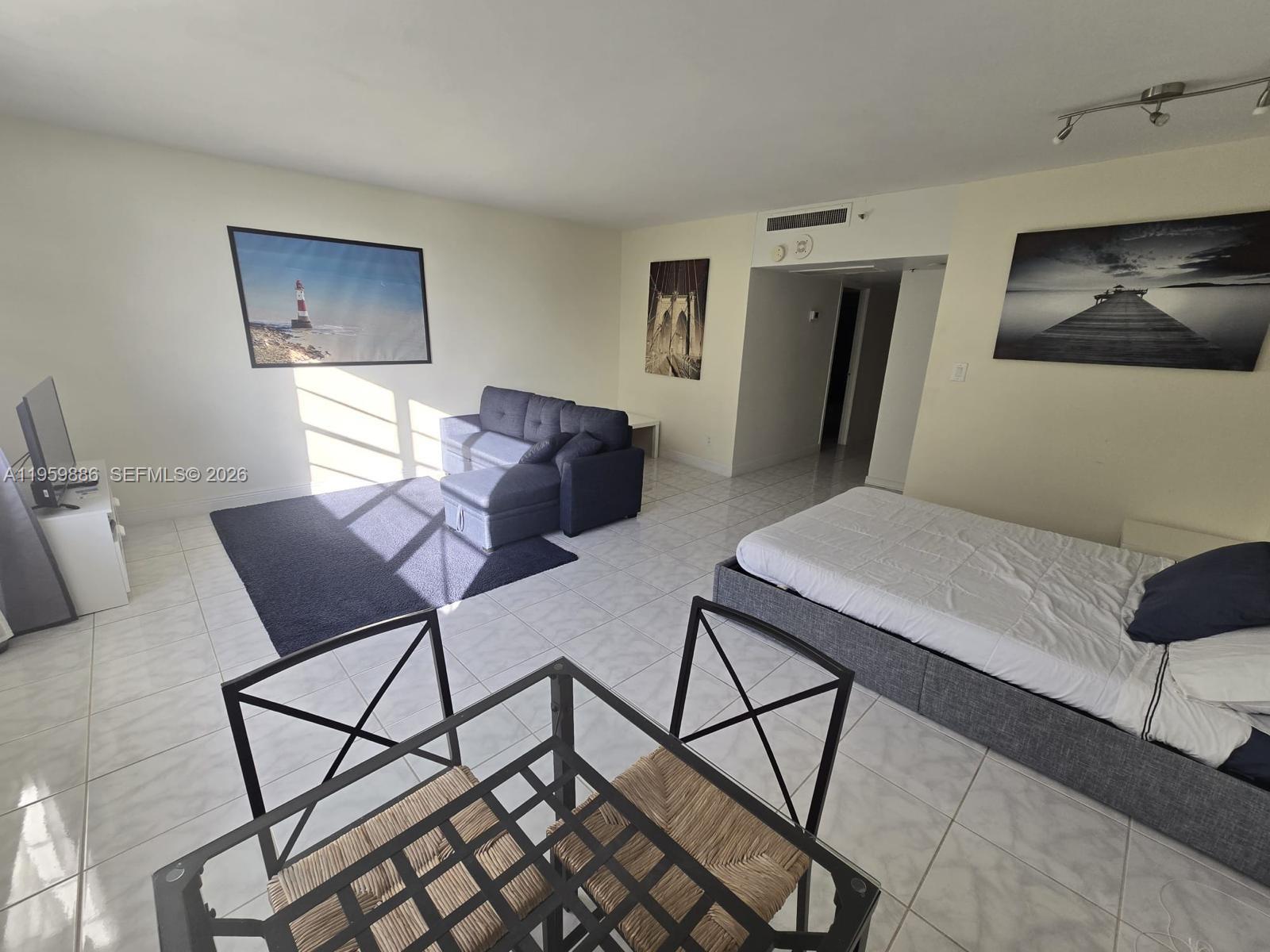 100 Lincoln Road, Unit 532 Miami Beach, FL 33139 - Photo 2 of 12 a view of a livingroom with furniture and a ceiling fan