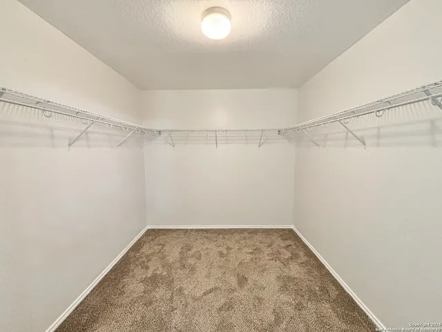 a view of a room with racks on the wall