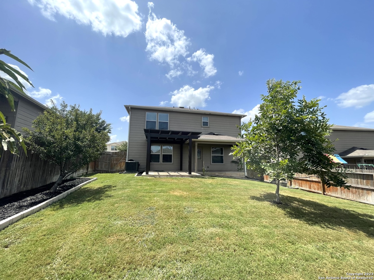 9358 Fisherman Converse, TX 78109 - Photo 17 of 22 a view of a house with a swimming pool