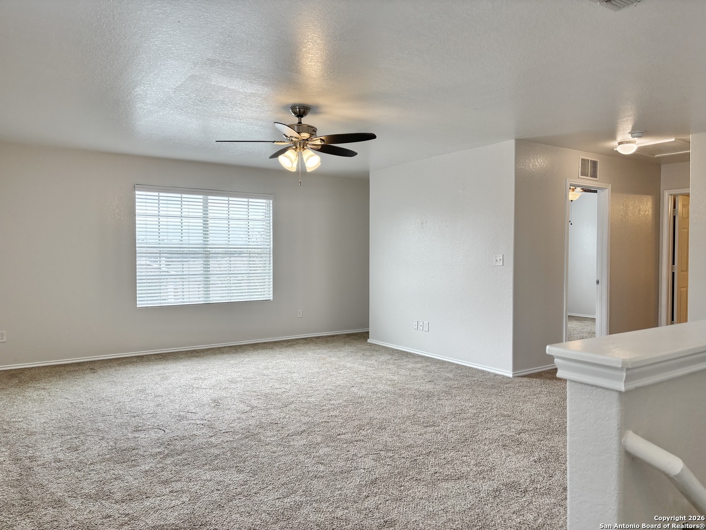 9358 Fisherman Converse, TX 78109 - Photo 8 of 22 an empty room with windows and fan