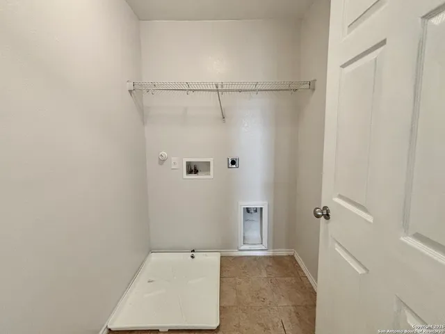 a bathroom with a tub and shower