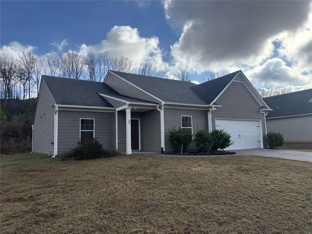 front view of a house with a yard