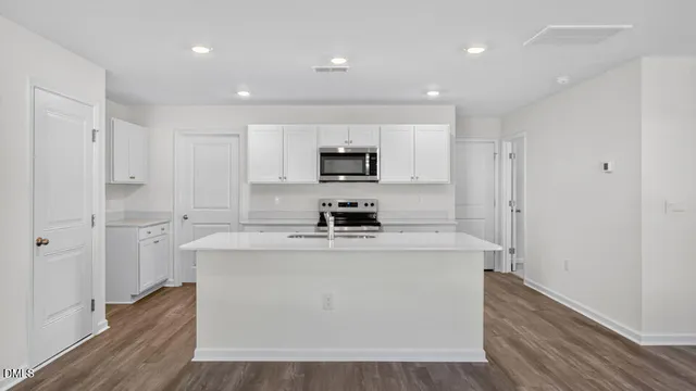 a view of a kitchen with electric appliances
