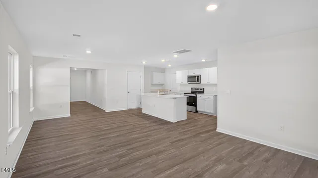 a view of kitchen with wooden floor