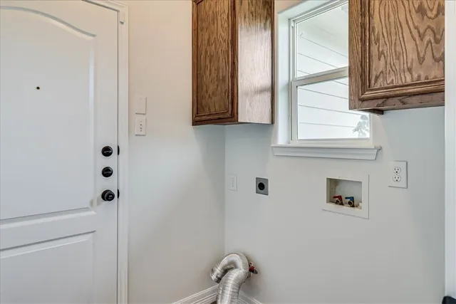 a bathroom with a window and mirror