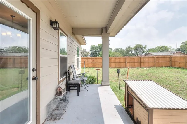 a balcony with furniture and a garden