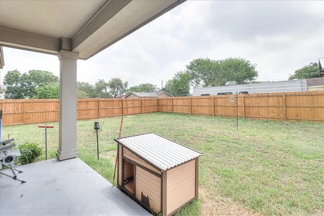 a view of a backyard with a garden and plants