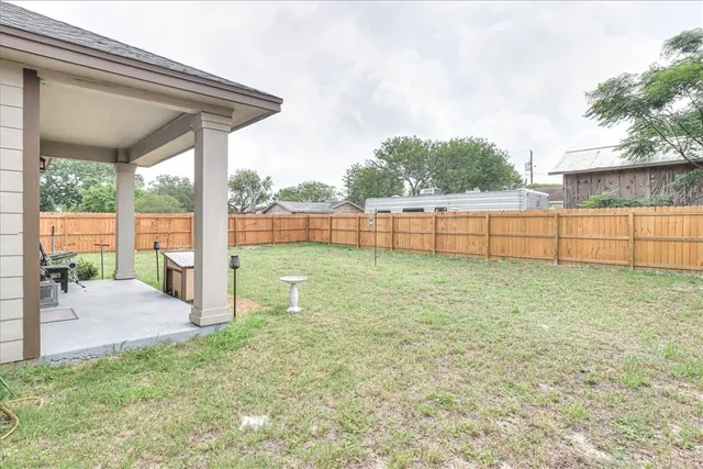 a view of a backyard with a garden and plants