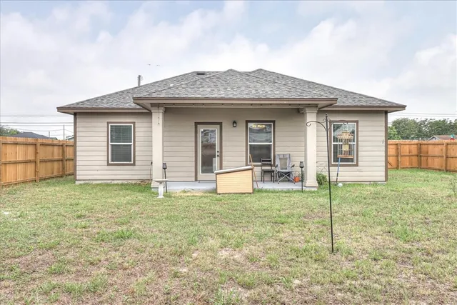 a house that has a big yard in front of it