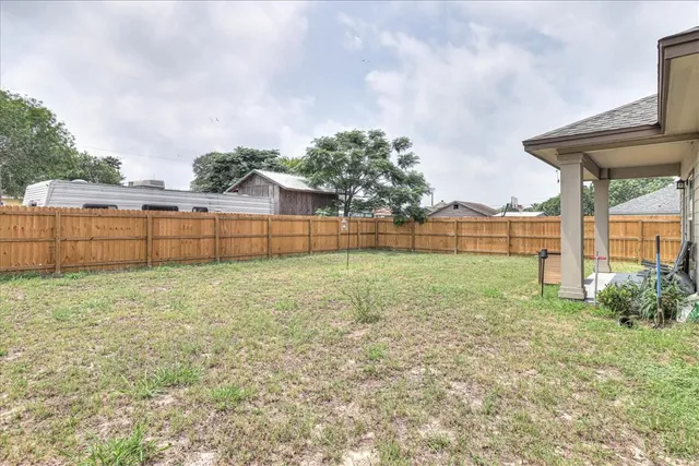 a view of backyard with green space