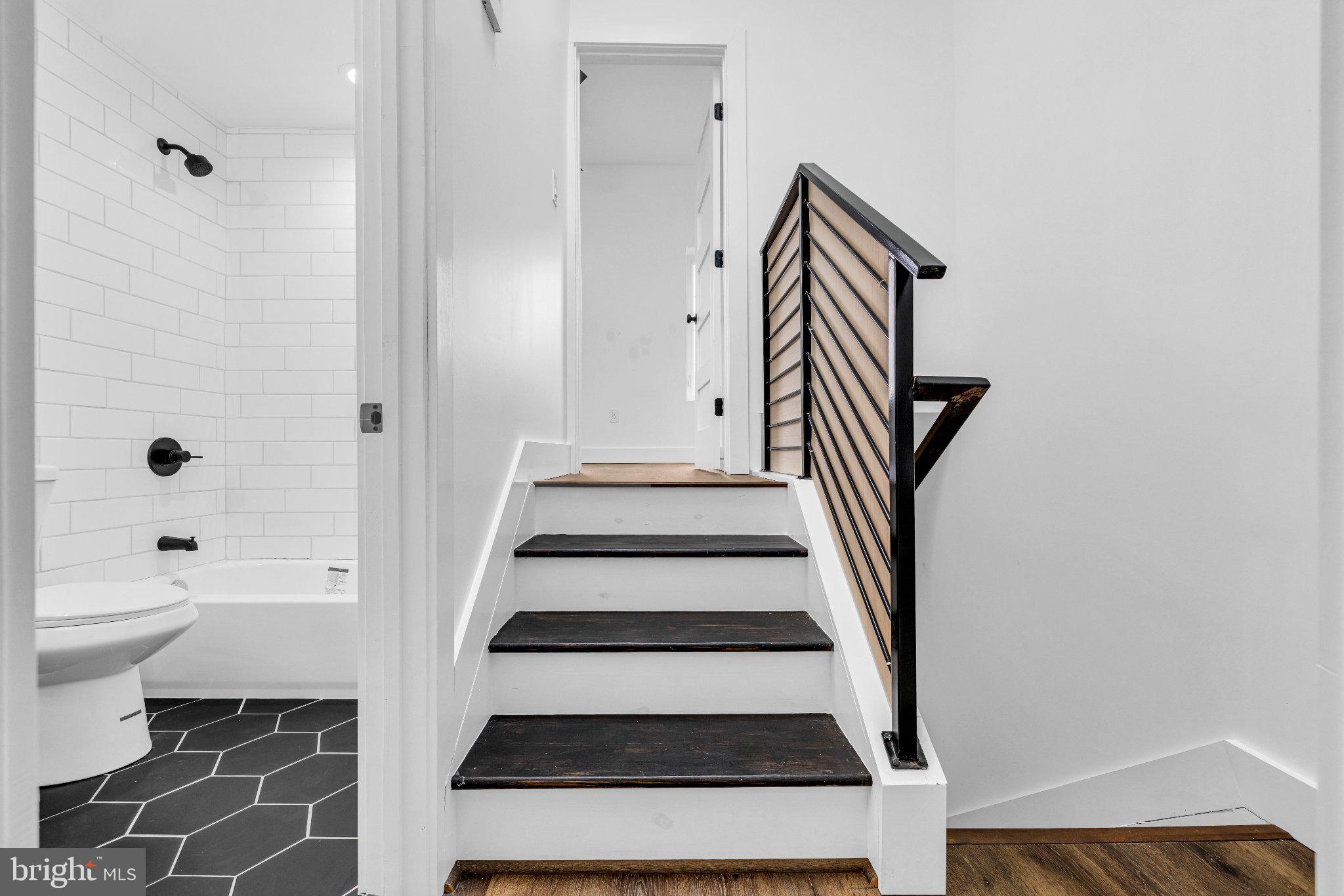 2731 Round Road Baltimore, MD 21225 - Photo 7 of 26 Modern staircase with sleek design.