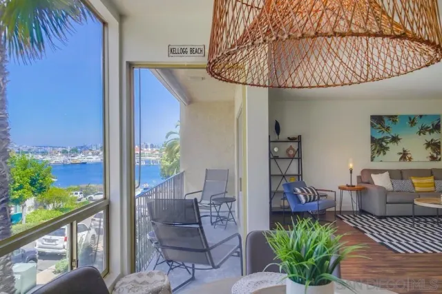 a outdoor living space with furniture and umbrella