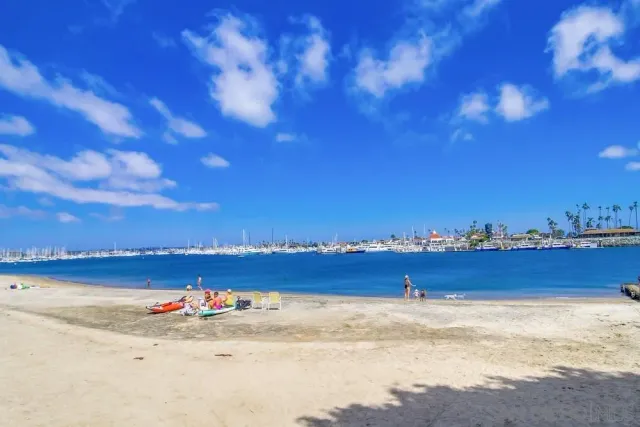 a view of an ocean beach and city