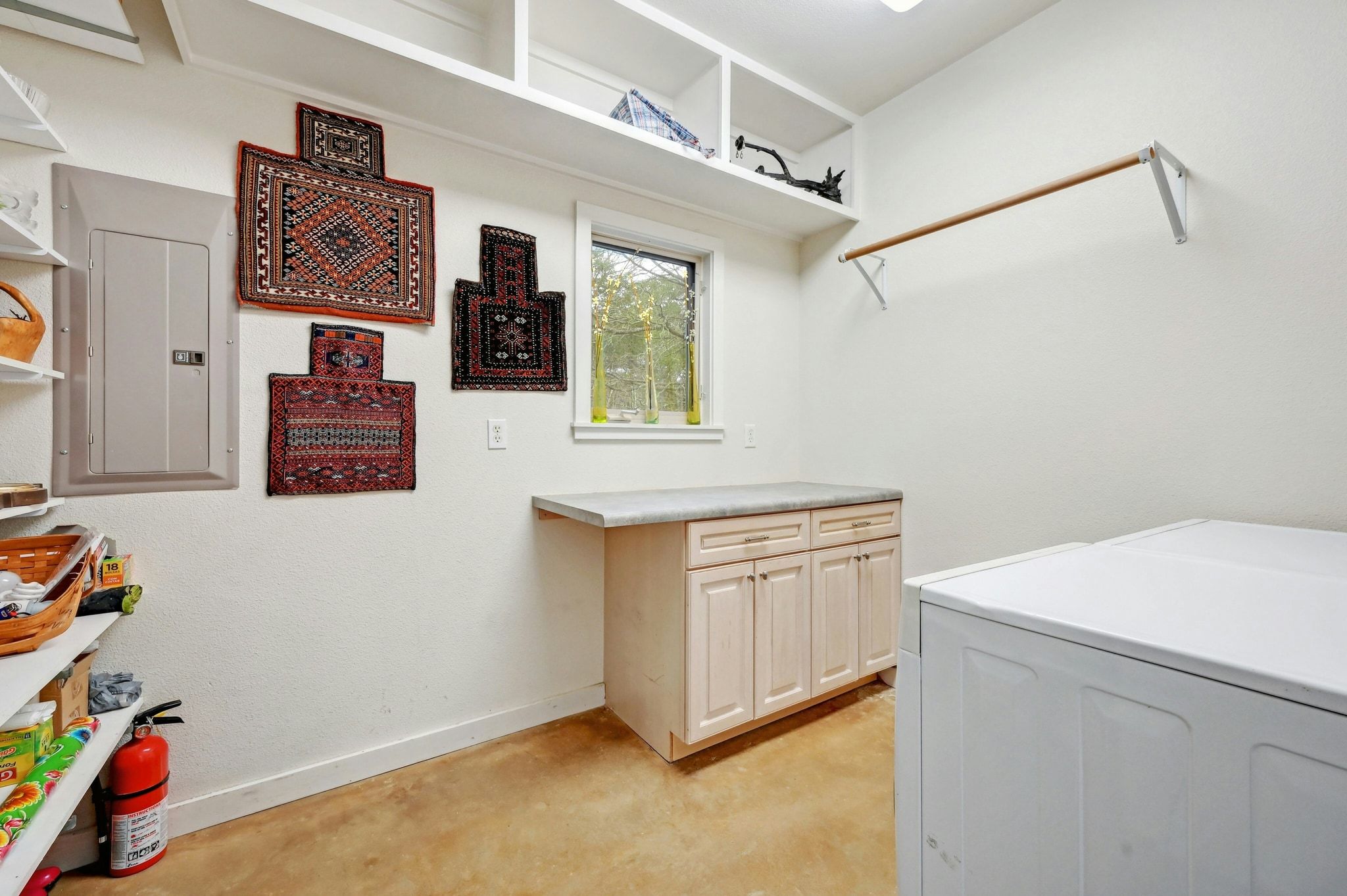 2147 Tejas Trail Blanco, TX 78606 - Photo 18 of 29 a utility room with stainless steel appliances cabinets and a potted plant
