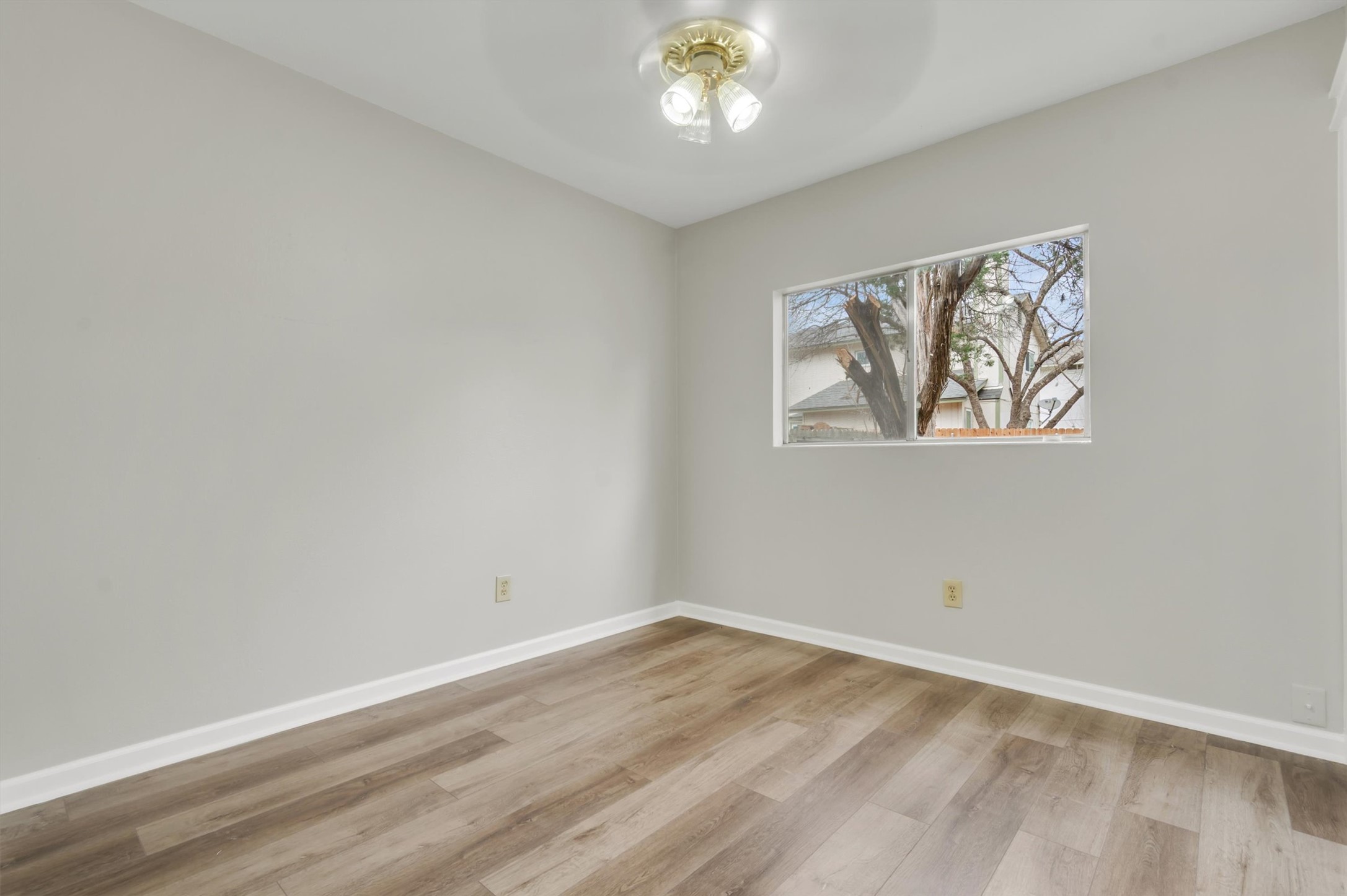720 Decker Prairie Drive Austin, TX 78748 - Photo 11 of 21 Spare room with light wood-type flooring and ceiling fan