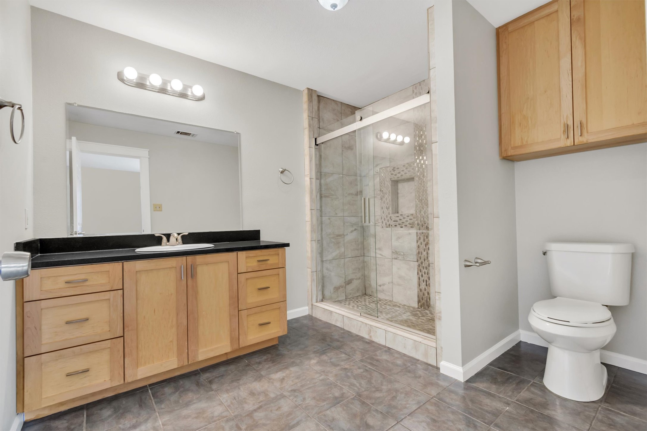 720 Decker Prairie Drive Austin, TX 78748 - Photo 13 of 21 Full bath featuring vanity and a shower stall