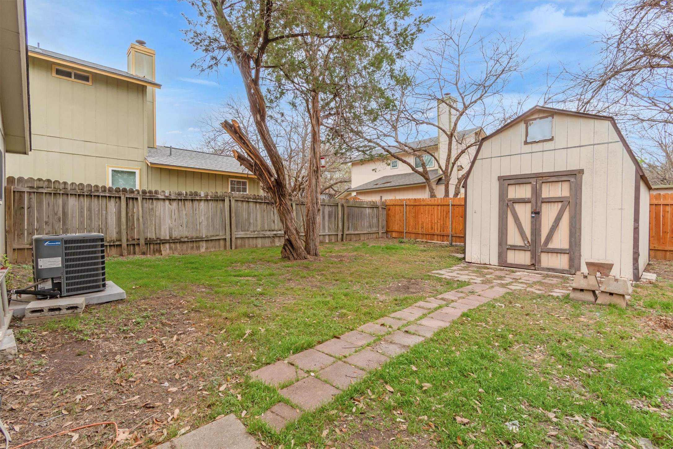 720 Decker Prairie Drive Austin, TX 78748 - Photo 20 of 21 Fenced backyard featuring a storage shed