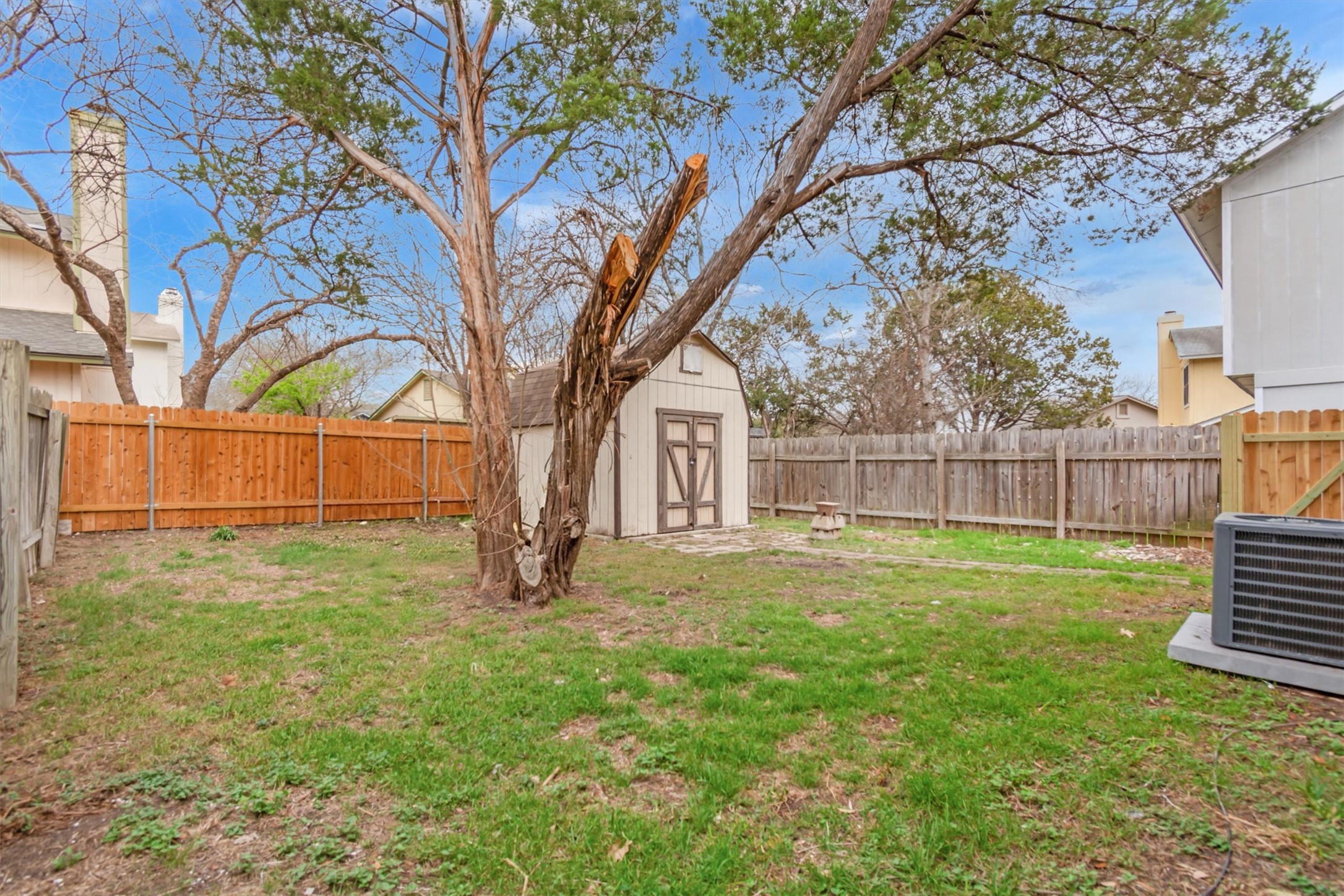 720 Decker Prairie Drive Austin, TX 78748 - Photo 21 of 21 Fenced backyard featuring a storage shed