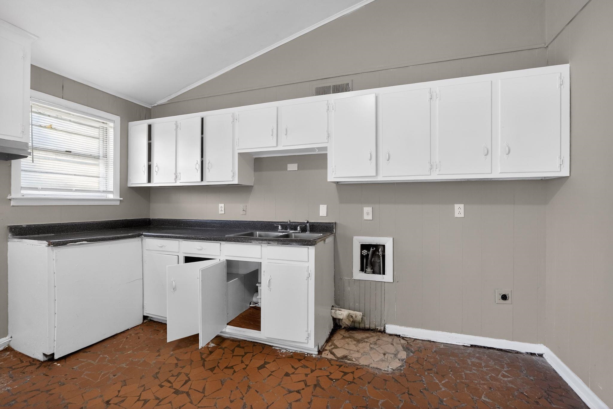 3445 Powers Road Memphis, TN 38128 - Photo 34 of 35 Kitchen featuring white cabinetry and dark countertops