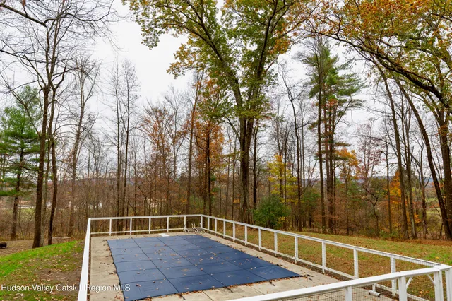 a view of a chairs and table in the patio