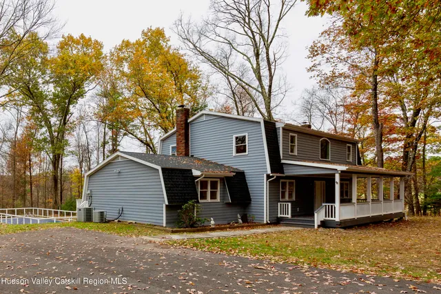a backyard of a house with large trees