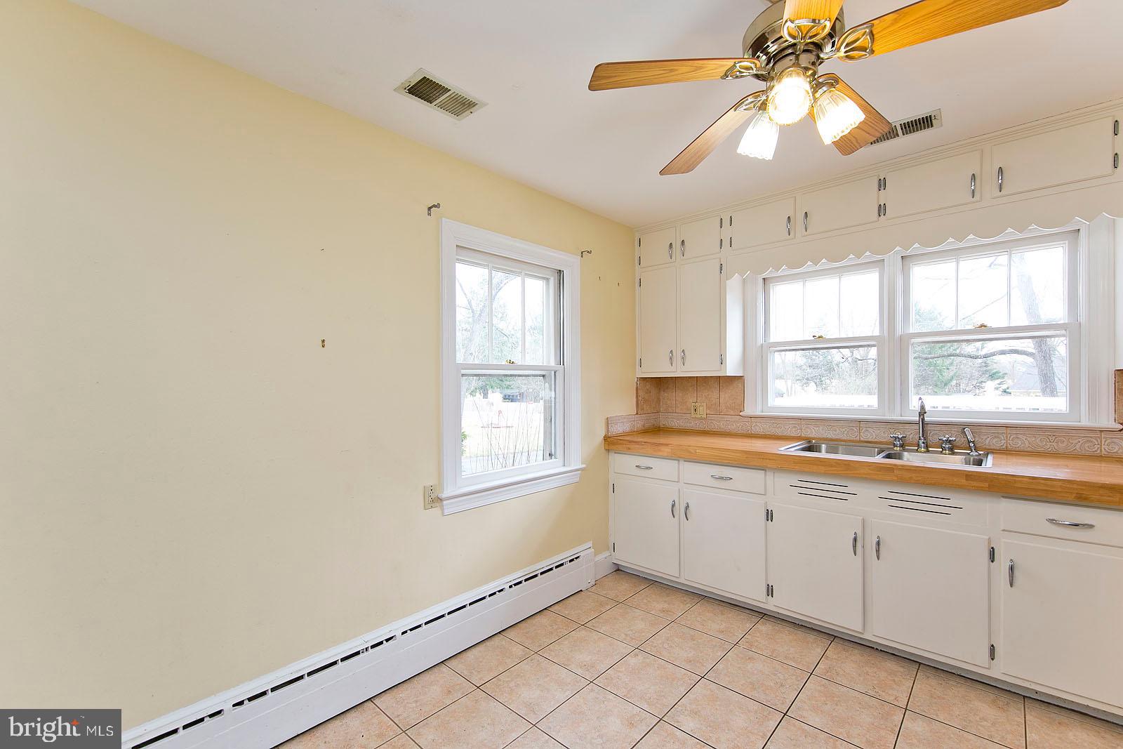 325 Berrys Ferry Road White Post, VA 22663 - Photo 13 of 60 a view of a kitchen with sink and window
