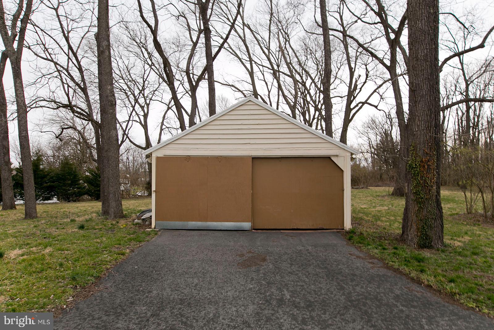 325 Berrys Ferry Road White Post, VA 22663 - Photo 3 of 60 a front view of a house with a yard and tree s