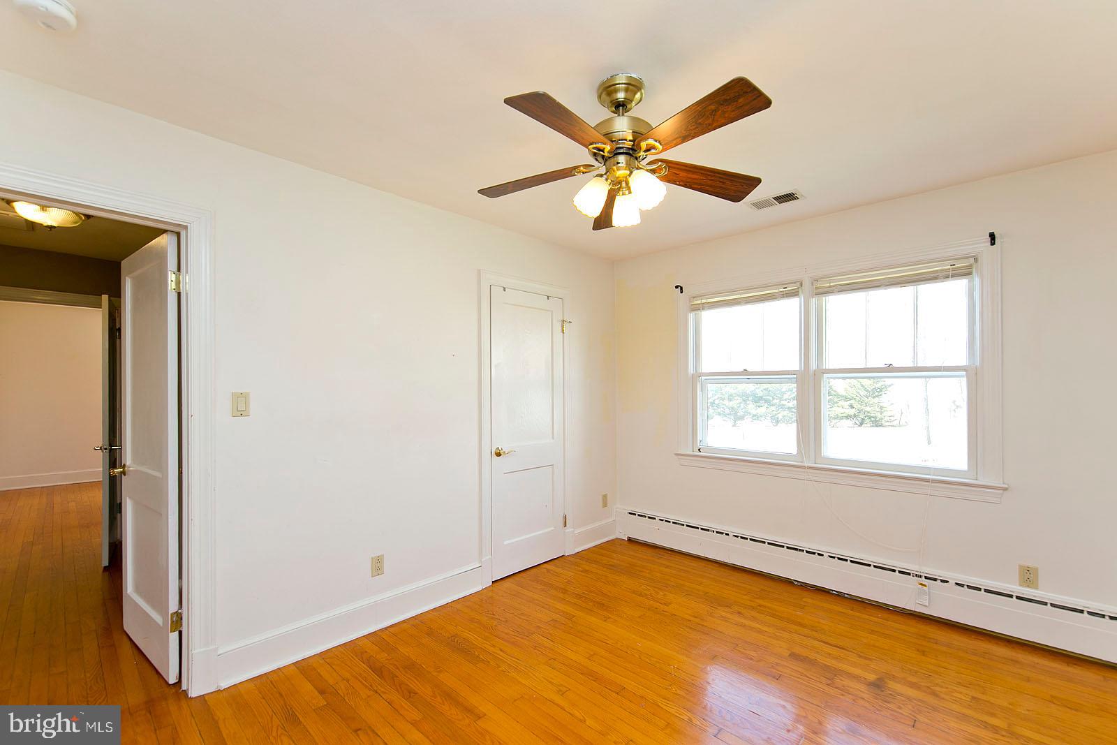 325 Berrys Ferry Road White Post, VA 22663 - Photo 21 of 60 a view of a room with wooden floor and windows