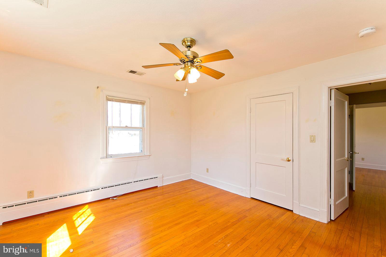 325 Berrys Ferry Road White Post, VA 22663 - Photo 25 of 60 an empty room with a window and a ceiling fan