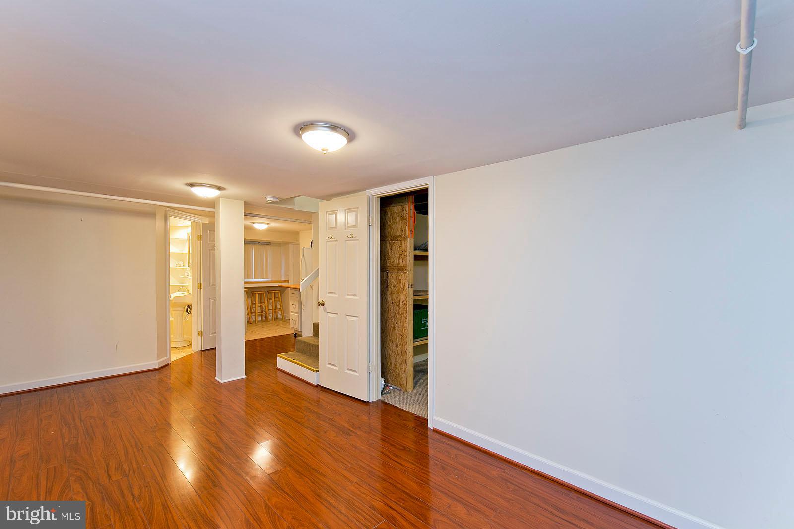 325 Berrys Ferry Road White Post, VA 22663 - Photo 33 of 60 a view of an empty room with wooden floor and a window