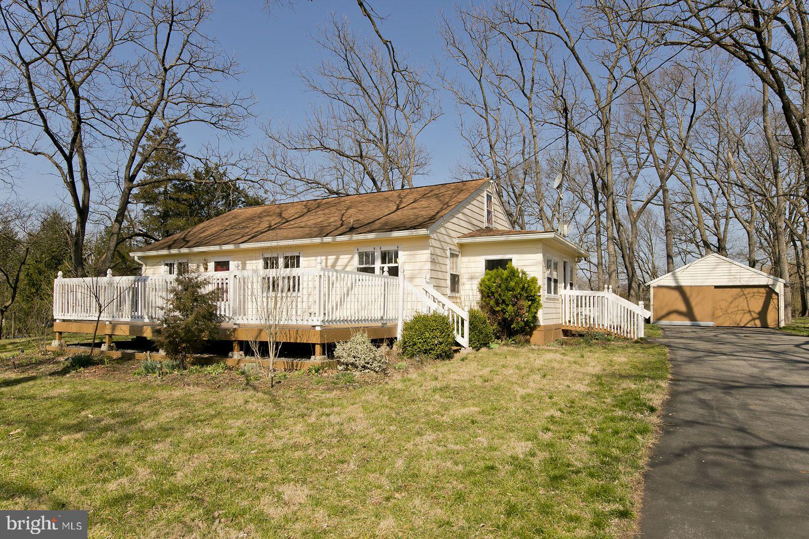 325 Berrys Ferry Road White Post, VA 22663 - Photo 45 of 60 a yellow house with trees in front of it