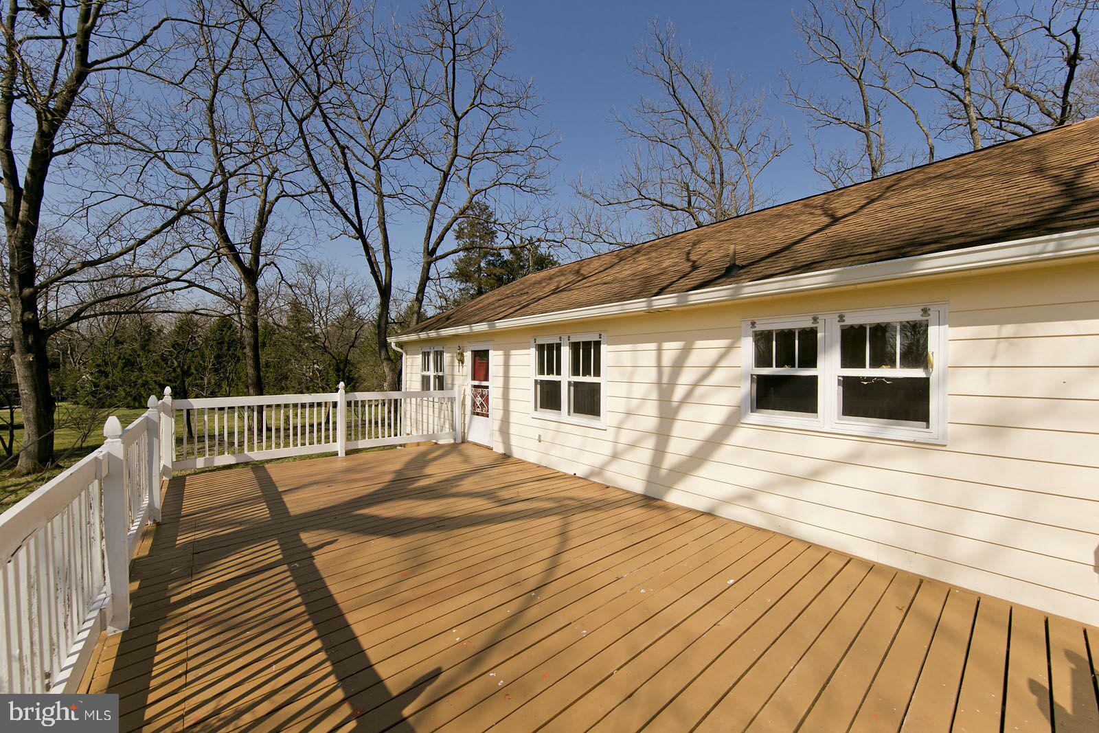 325 Berrys Ferry Road White Post, VA 22663 - Photo 48 of 60 a view of house with wooden floor and large trees