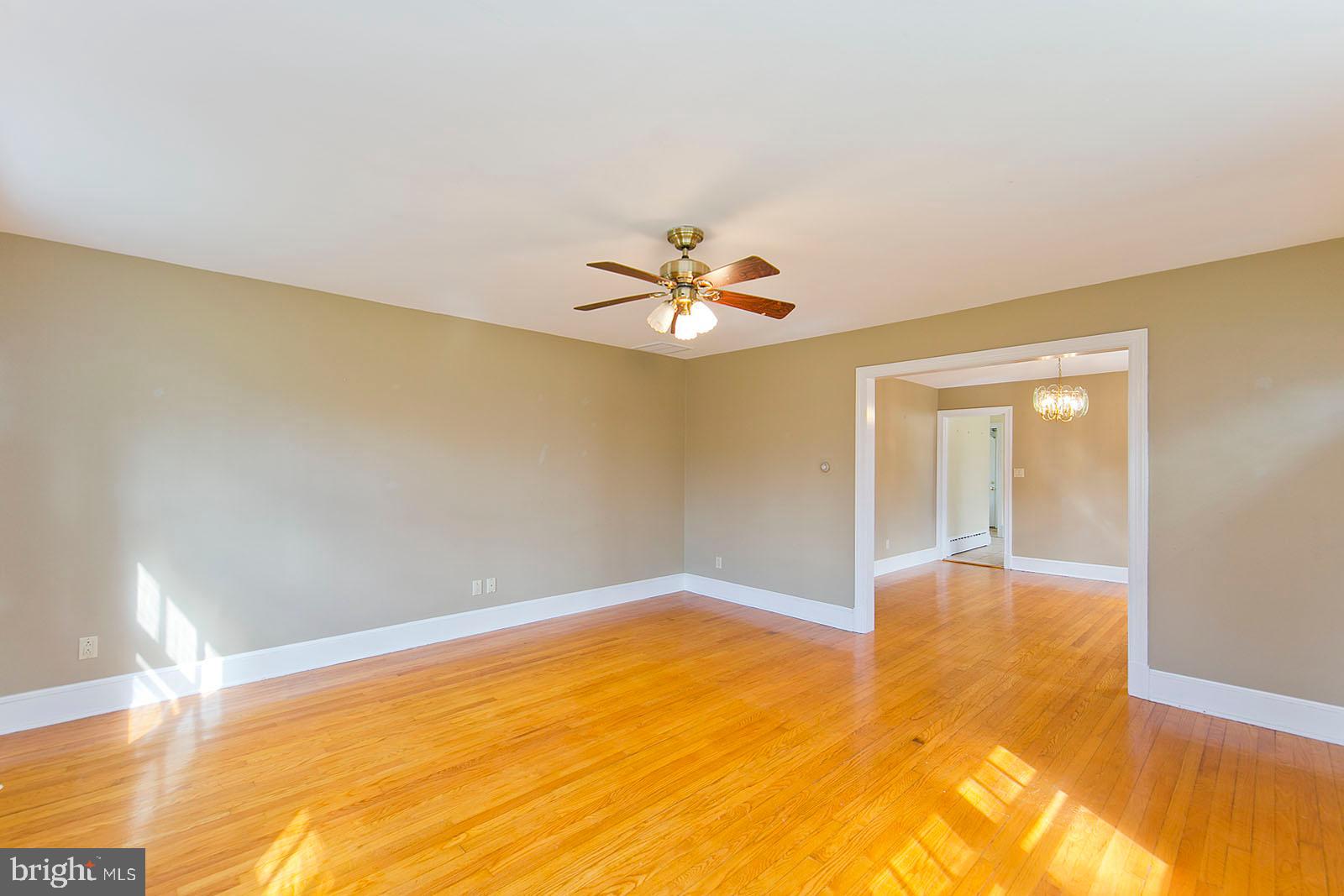 325 Berrys Ferry Road White Post, VA 22663 - Photo 9 of 60 a view of a livingroom with a ceiling fan and window