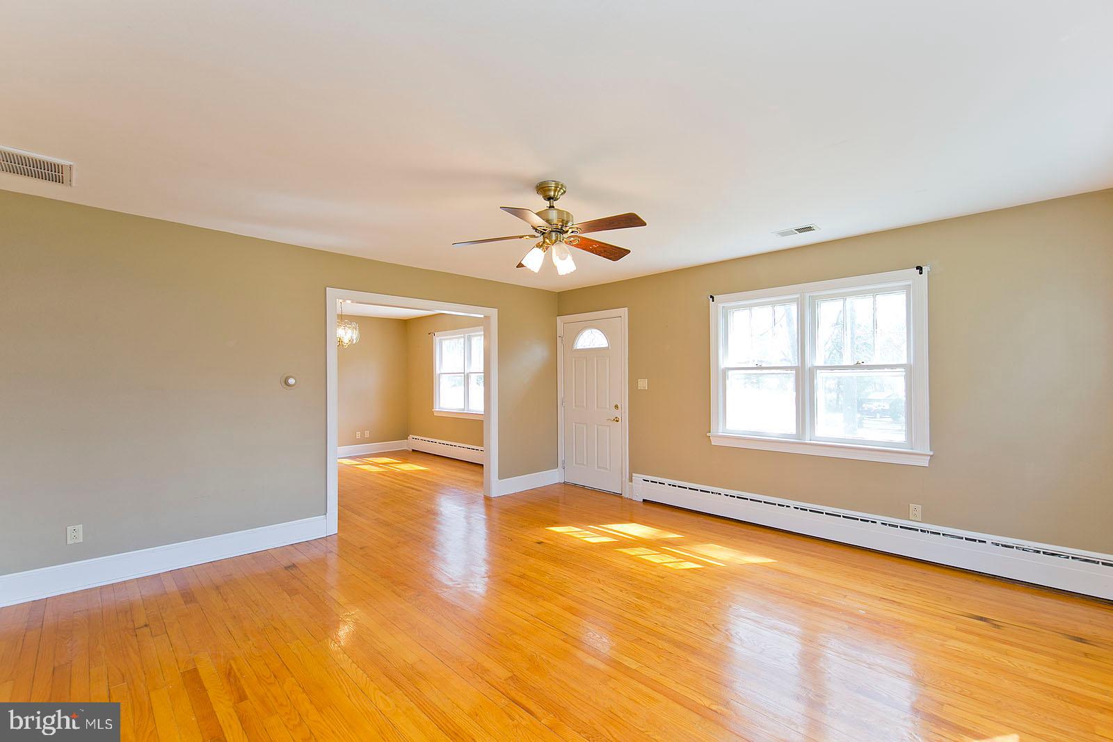 325 Berrys Ferry Road White Post, VA 22663 - Photo 10 of 60 a view of an empty room with window and a kitchen