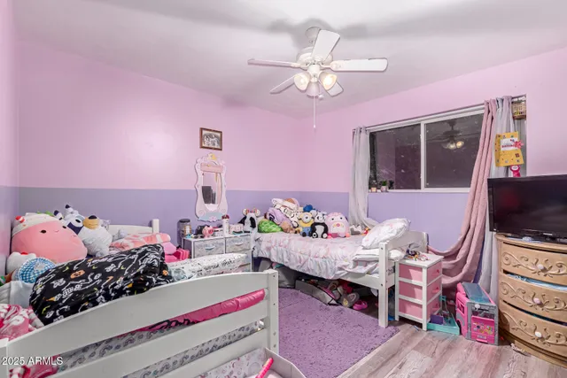 a bedroom with furniture and a chandelier