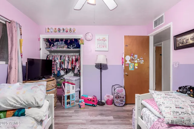 a bedroom with bed and a couch