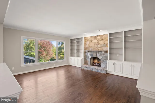 a kitchen with a sink a stove and cabinets