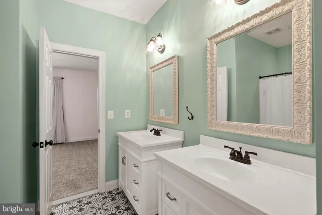 an aerial view of a house with swimming pool in front of it