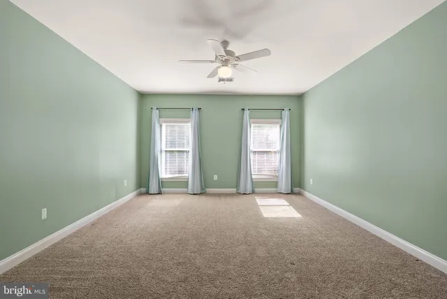 a view of a chairs and table in the yard