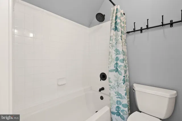 a view of a grassy field with trees