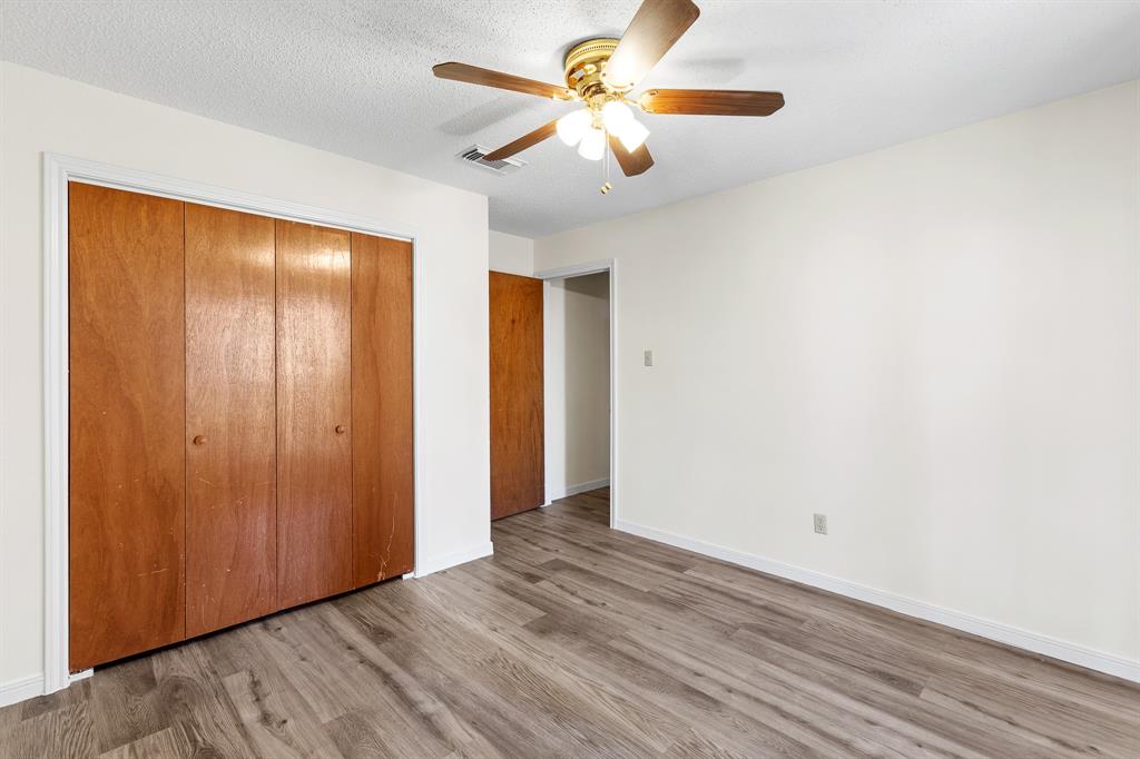 8548 Old Lockhart Road Buda, TX 78610 - Photo 14 of 19 wooden floor in an empty room