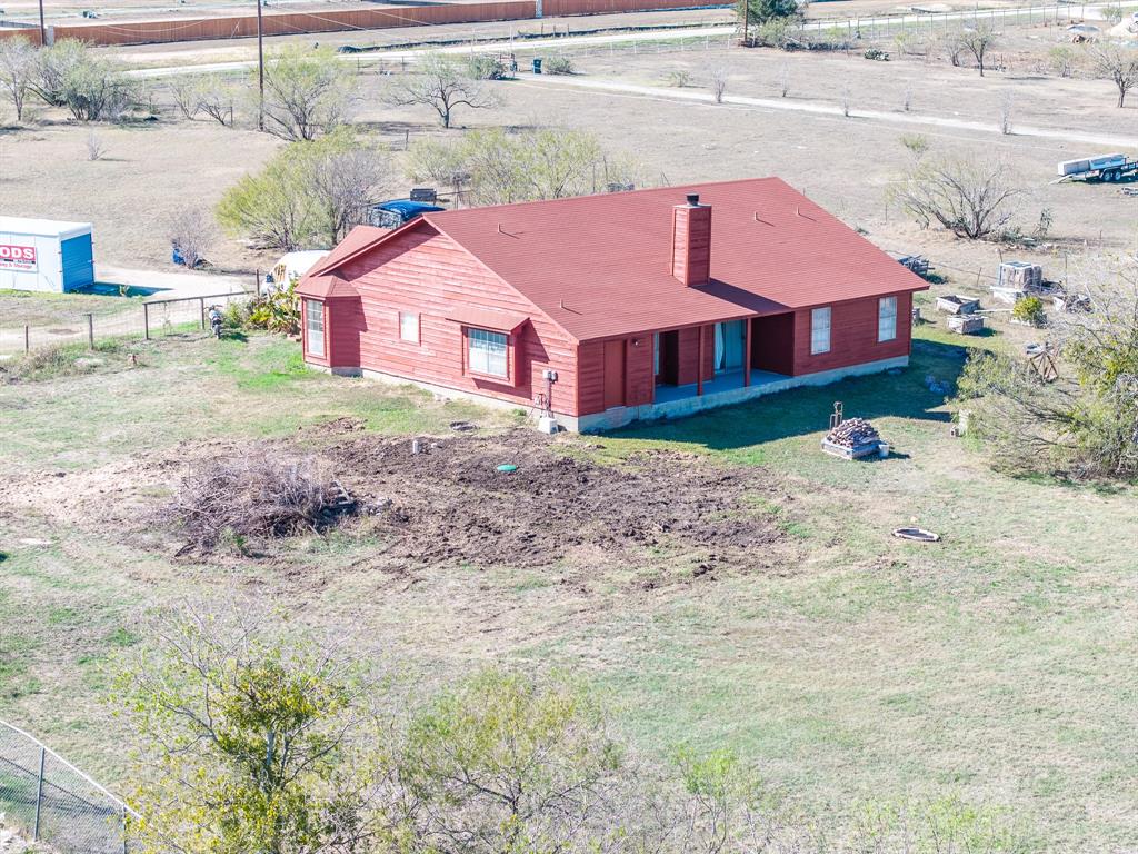 8548 Old Lockhart Road Buda, TX 78610 - Photo 18 of 19 a view of a house with a yard