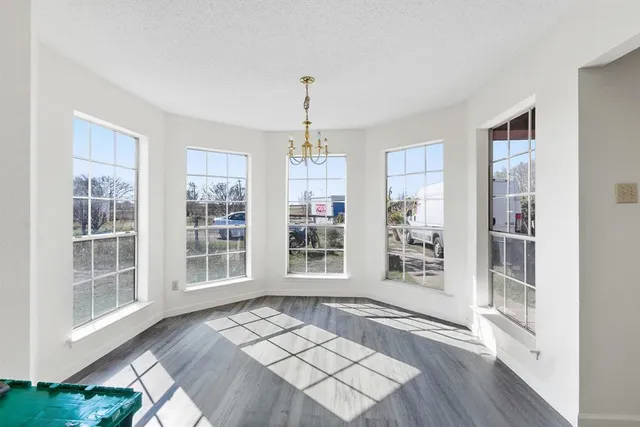 a view of a livingroom with an empty space and a fireplace