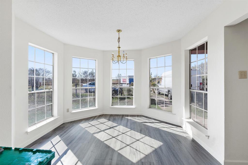 8548 Old Lockhart Road Buda, TX 78610 - Photo 5 of 19 a view of an empty room with windows