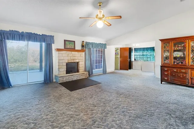 a view of hallway with wooden floor and staircase