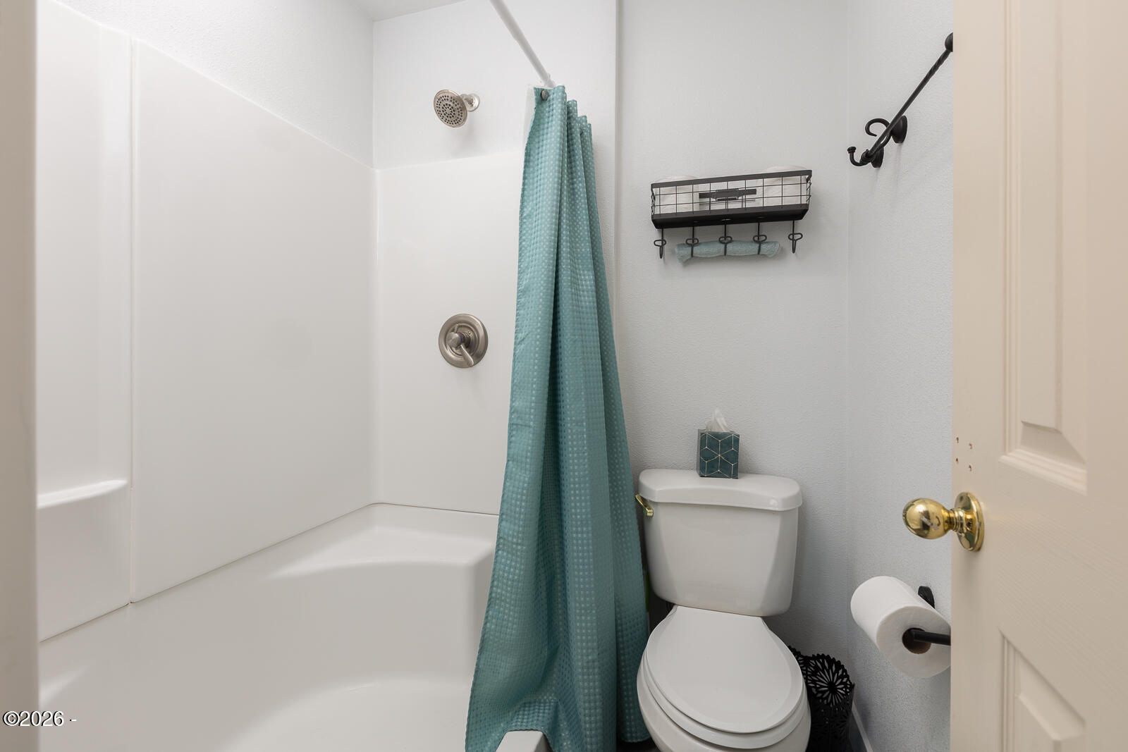 6905 Northeast Highland Road Otis, OR 97368 - Photo 50 of 76 a white toilet sitting next to a bath tub and a shower