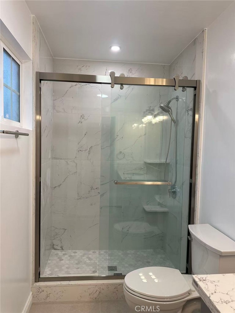 3044 Hodges Avenue Arcadia, CA 91006 - Photo 12 of 13 a white toilet sitting next to a shower