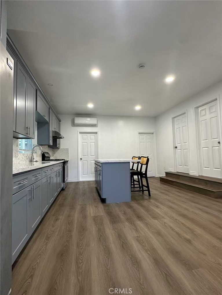 3044 Hodges Avenue Arcadia, CA 91006 - Photo 3 of 13 a kitchen with stainless steel appliances granite countertop a stove a sink a refrigerator and white cabinets with wooden floor