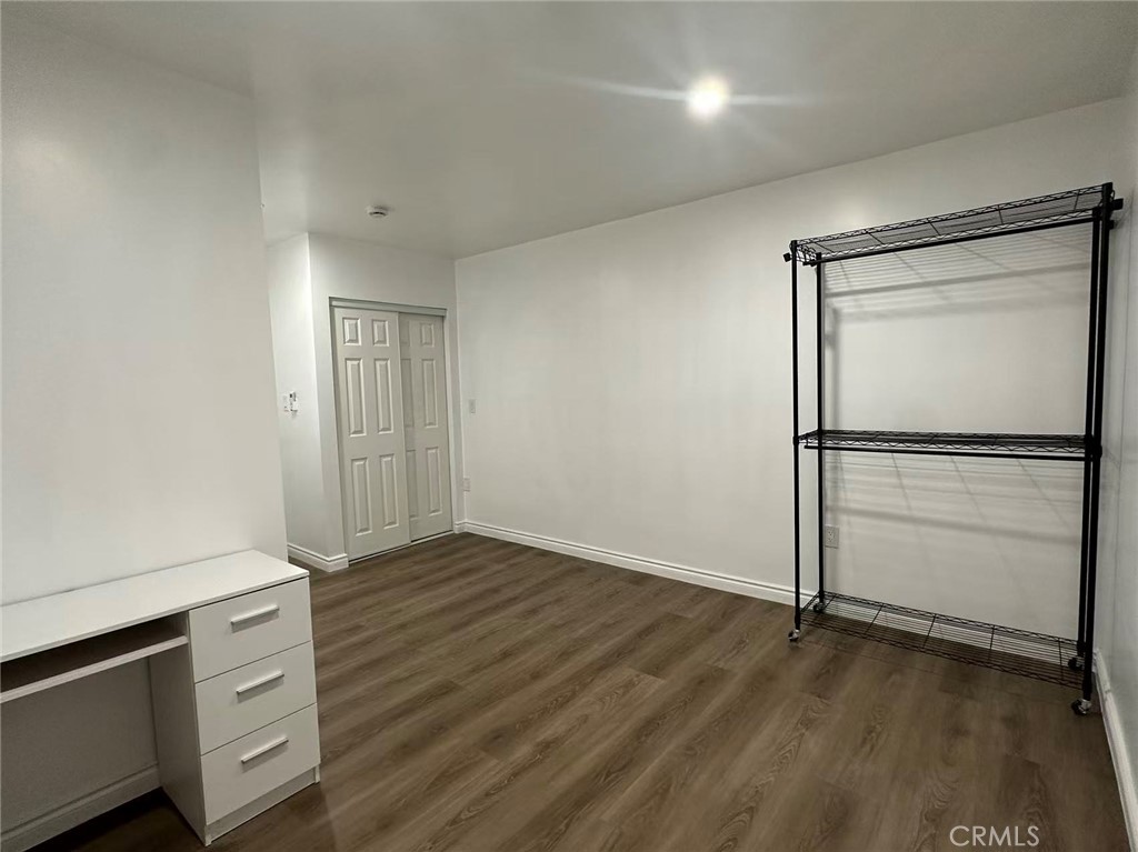 3044 Hodges Avenue Arcadia, CA 91006 - Photo 5 of 13 a view of an empty room with wooden floor and a window