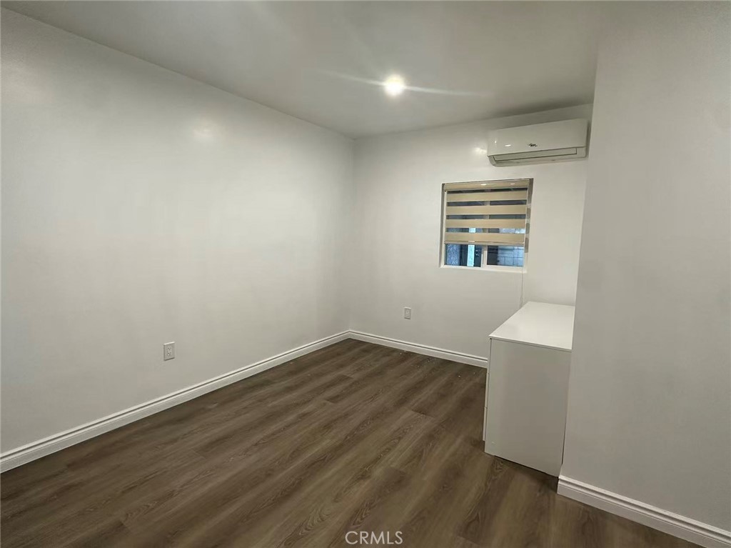 3044 Hodges Avenue Arcadia, CA 91006 - Photo 6 of 13 an empty room with wooden floor and windows